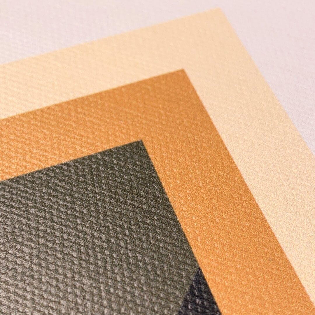 Zoomed in detailed shot of the Ascent case featuring four-layered arrow print on cotton canvas in green, yellow, beige and white