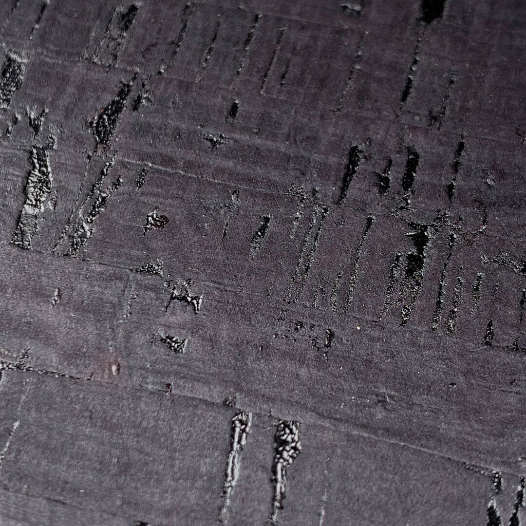 Zoomed in detailed shot of the dyed black natural cork phone case