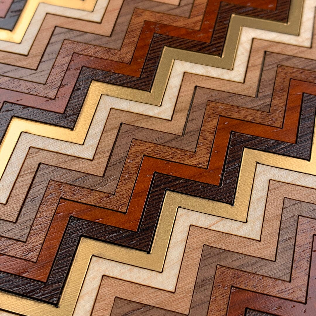 Head-on zoomed in detailed shot of the Echo case featuring a tight pattern of Walnut, Wenge, Maple, and Padauk wood