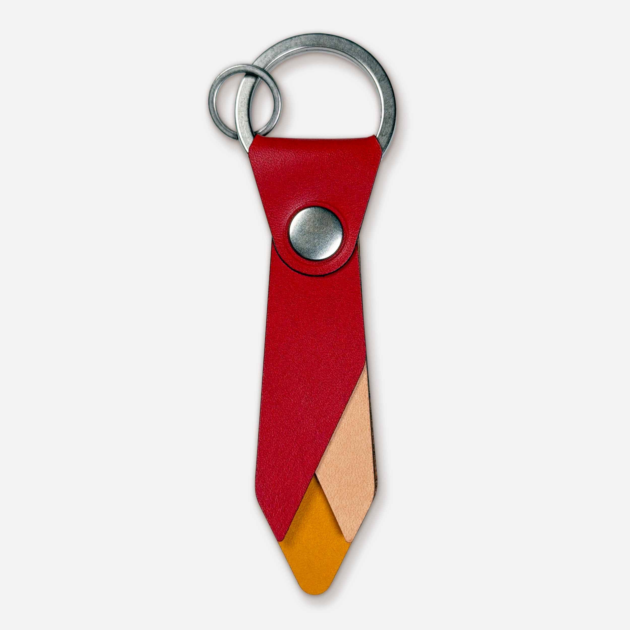 Front view of Keyway Ember leather keychain with nickel hardware and layered flame design