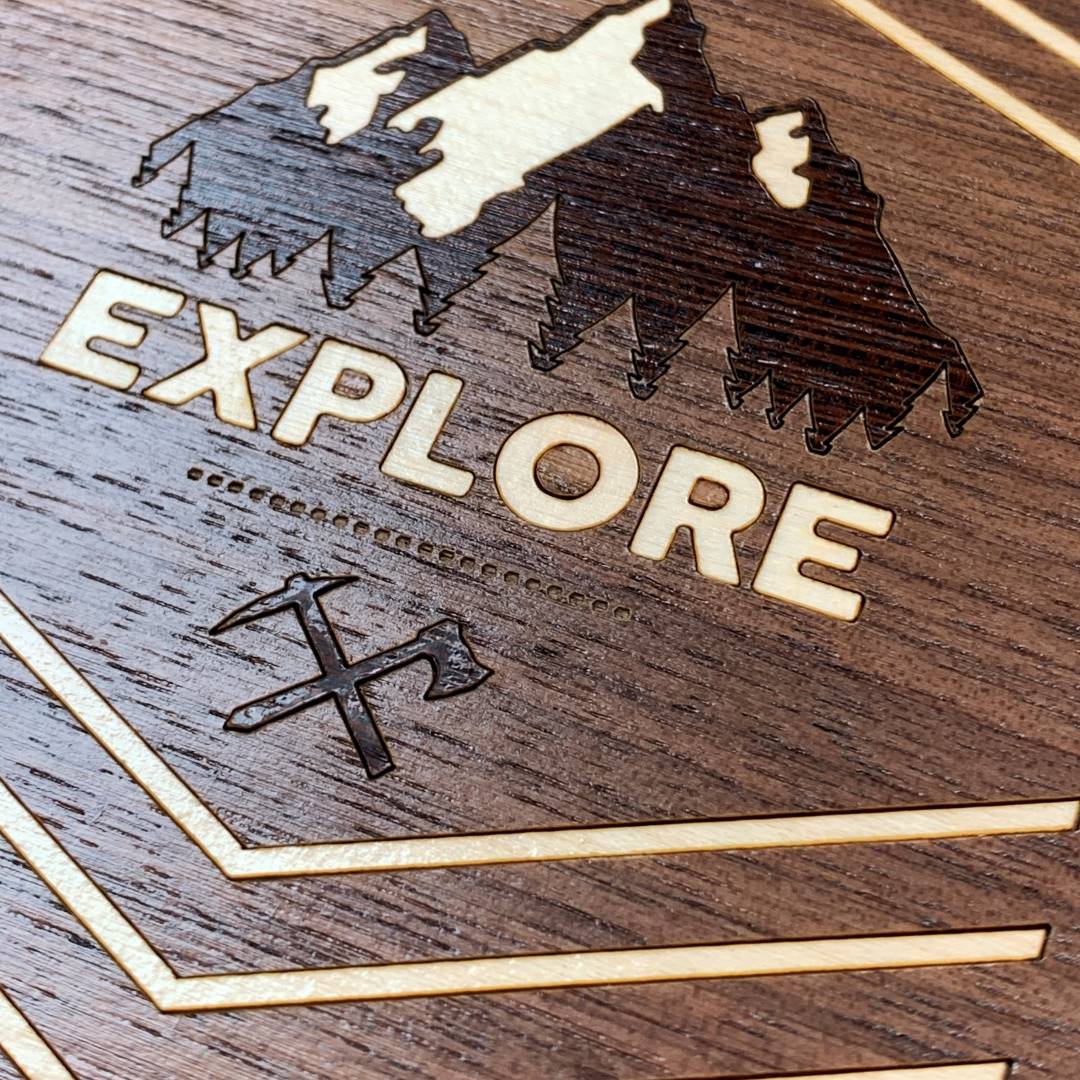 Zoomed in detailed shot of the Explore Case featuring a Wenge and Maple Mountain Range inlay on a Walnut Wood backer
