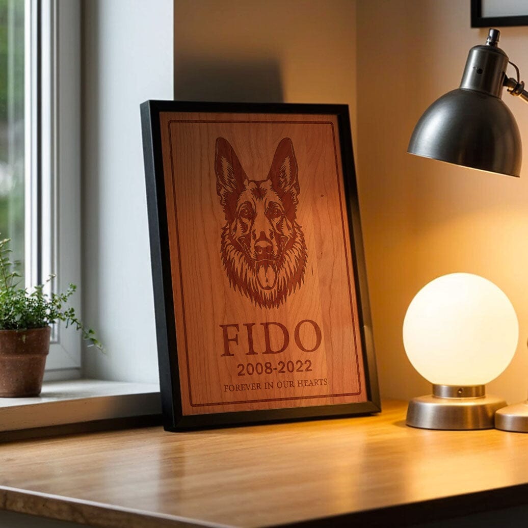 Laser-engraved wooden dog tribute board framed in black, featured in a contemporary office or study setting. Detailed craftsmanship on maple wood provides a meaningful memorial and sophisticated décor.