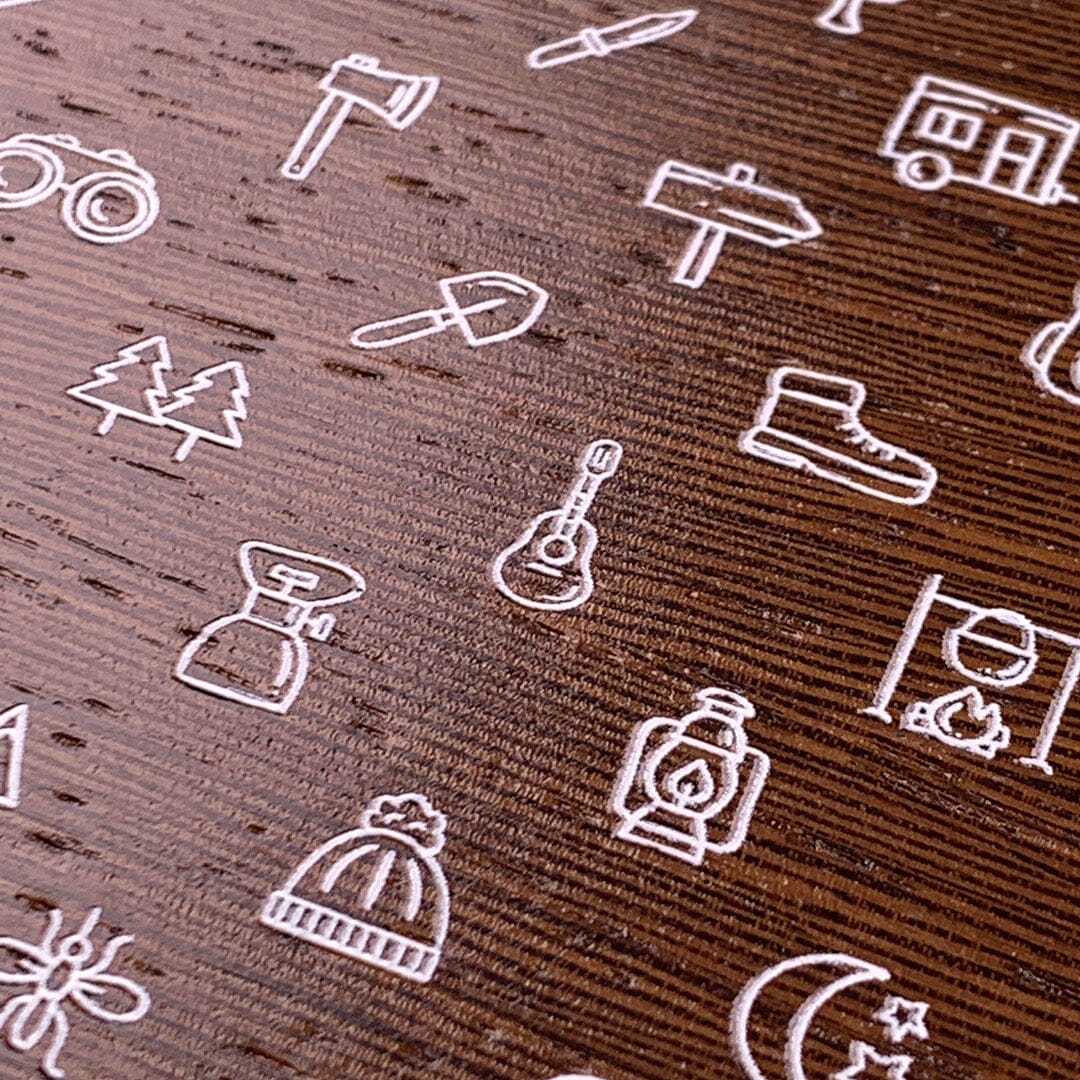 Zoomed in detailed shot of the fun detailed camping icon print on Wenge wood phone case by Keyway
