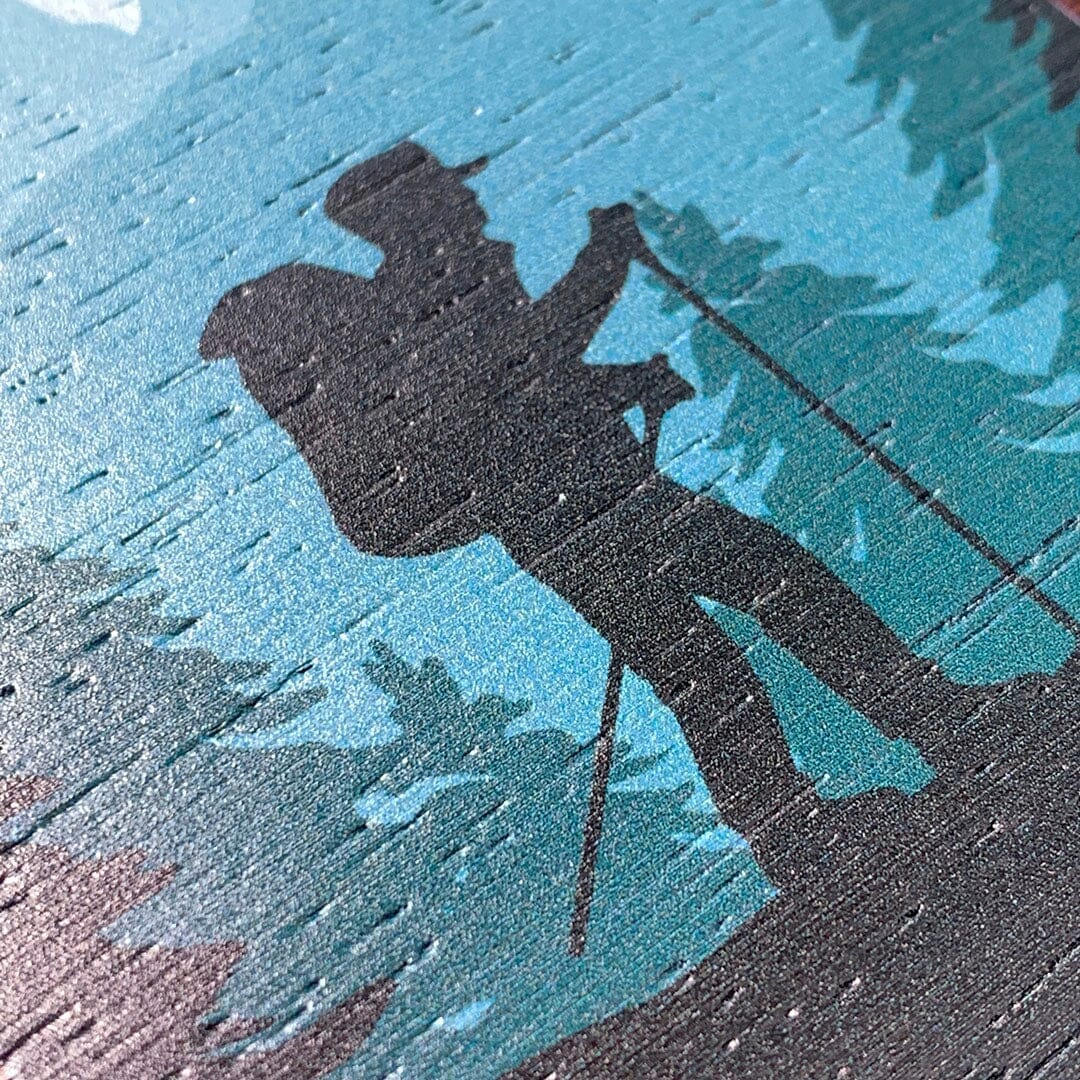 Zoomed in detailed shot of the stylized mountain hiker print on Wenge wood phone case by Keyway