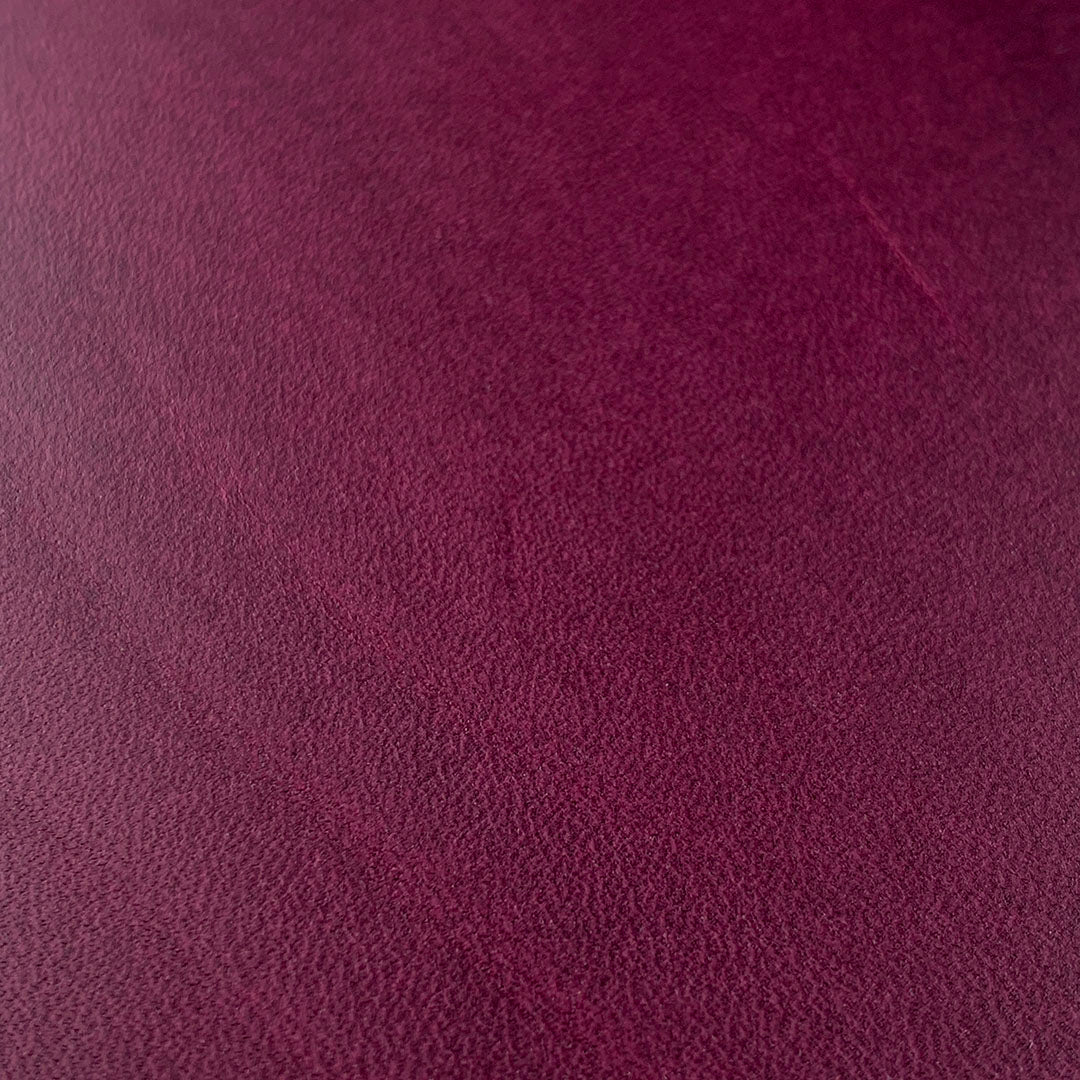 Zoomed detail shot of the grain on the Plum leather phone case by Keyway