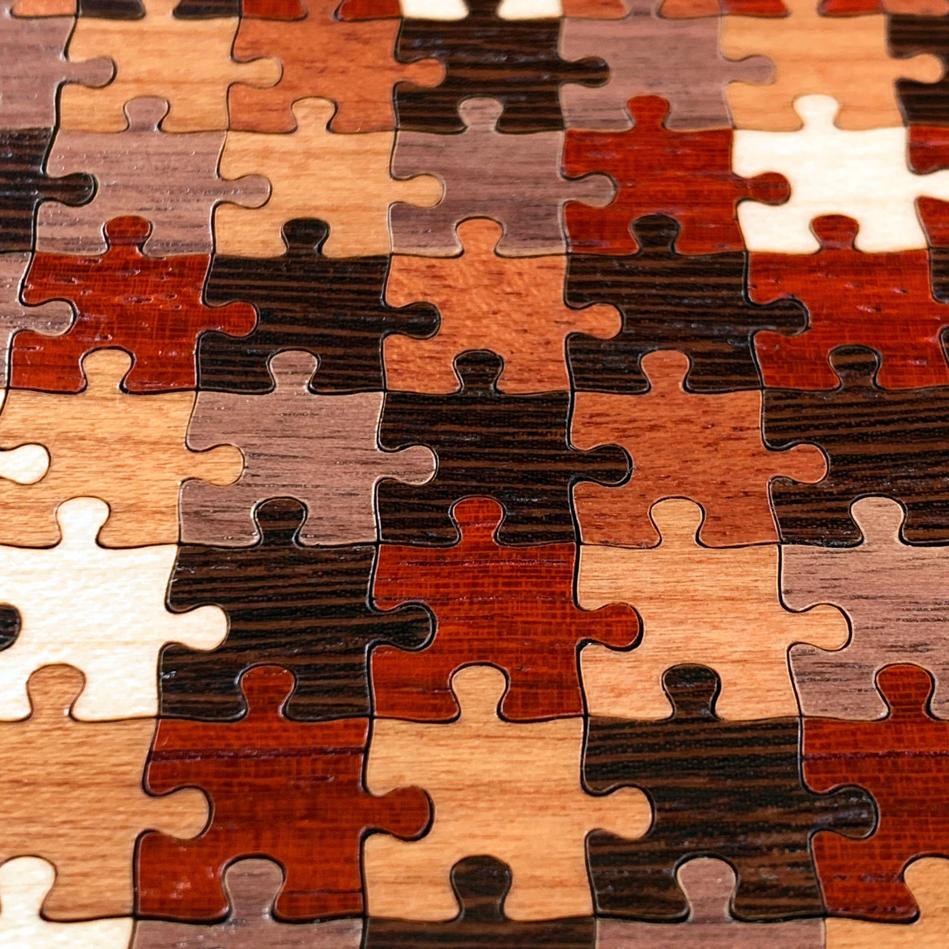 Zoomed in detail shot of the Wenge, Maple, Cherry, Walnut and Padauk puzzle pieces wood phone case by Keyway