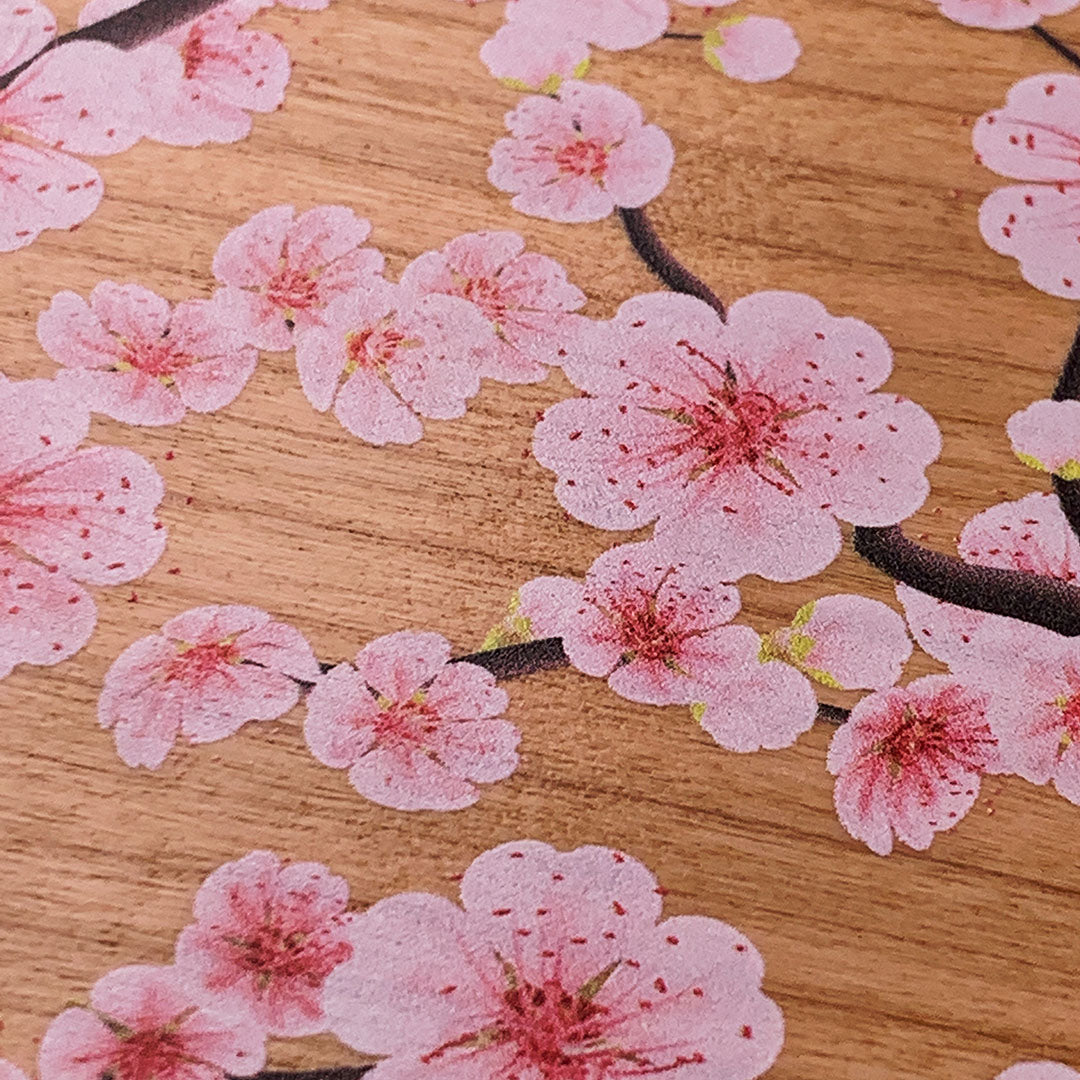Zoomed in detail shot of the Sakura cherry blossoms printed on Cherry wood phone case by Keyway