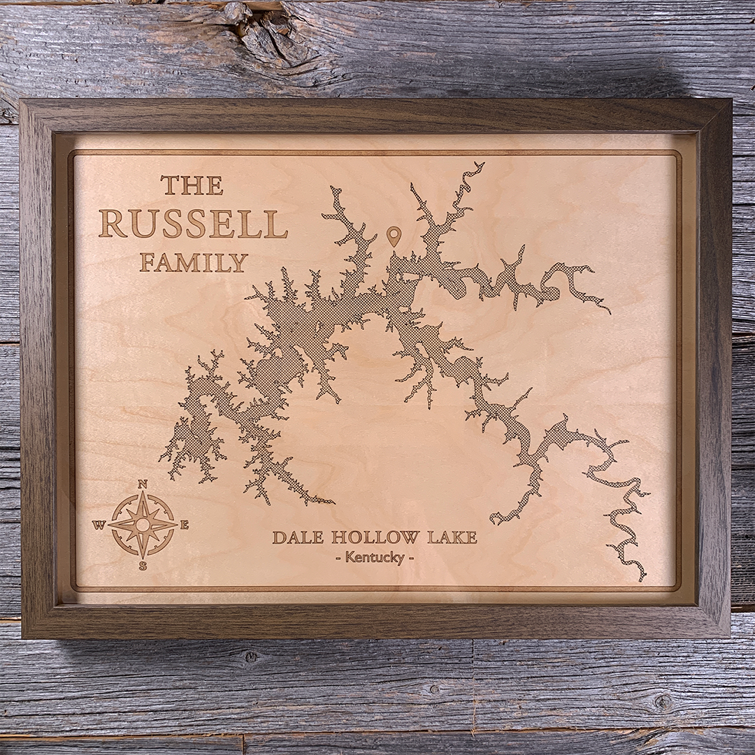 Framed laser-engraved wood map of Dale Hollow Lake in Kentucky, personalized with family name. Crafted from natural maple and set in a dark wood frame, this rustic wall art is perfect for lake homes, cabins, and meaningful family gifts.