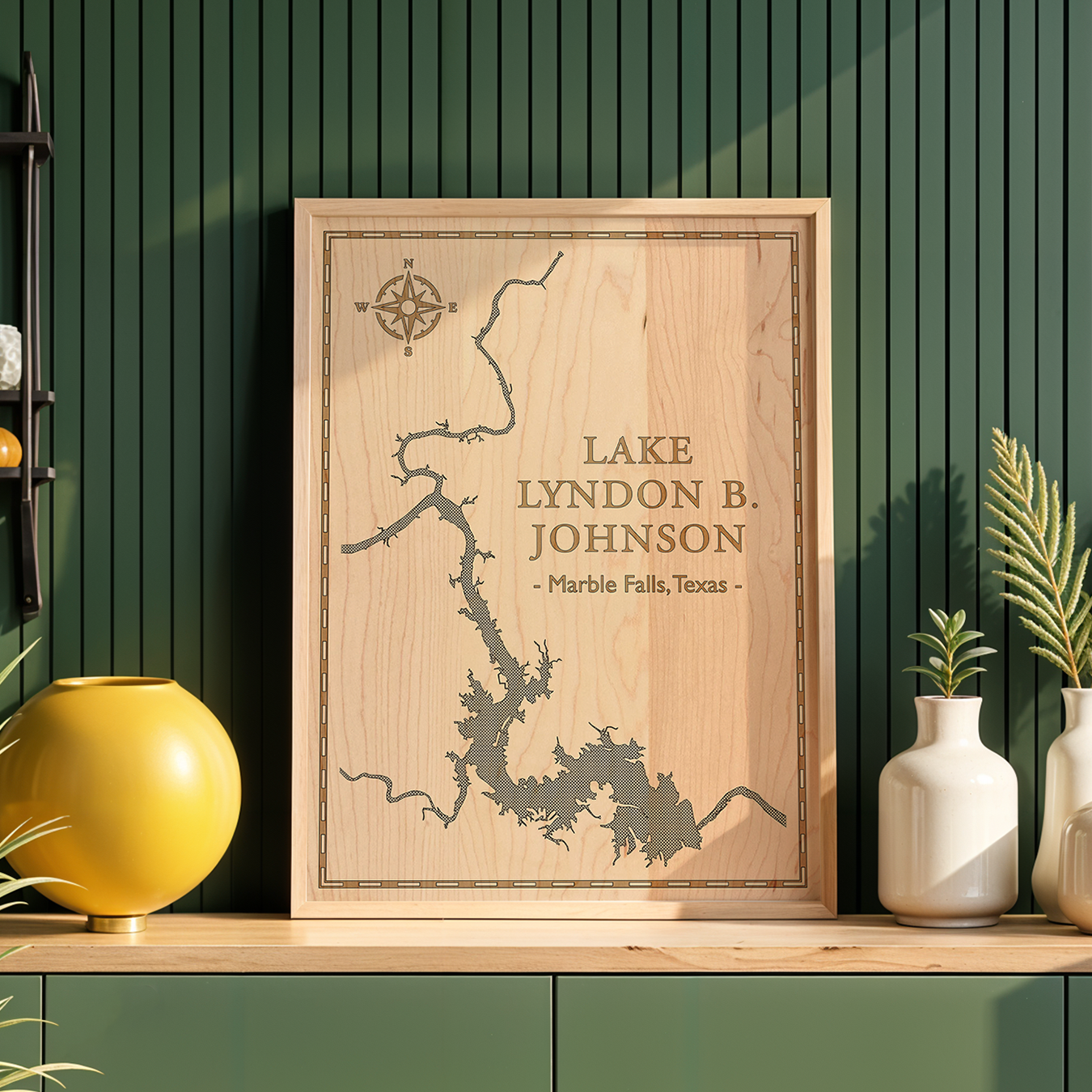 Framed laser-engraved wood map of Lake Lyndon B. Johnson, Marble Falls, Texas, displayed in a modern home interior. Natural maple and minimalist linework create a refined and rustic décor accent for lake lovers.