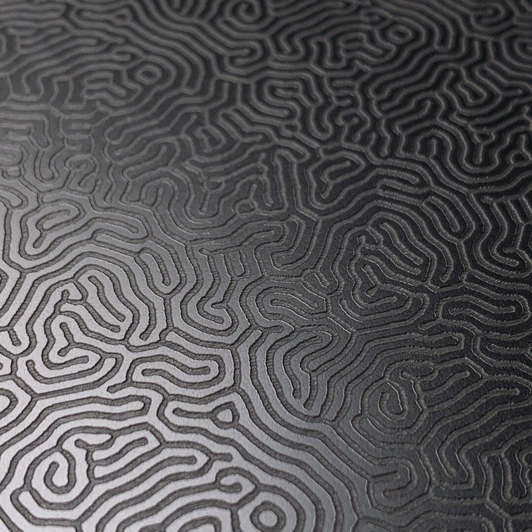 Zoomed in detailed shot of the highly detailed organic growth engraving on matte black impact acrylic iPhone 13 Pro Max Case by Keyway Designs