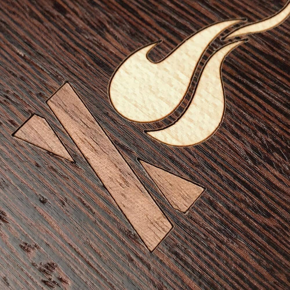 Zoomed in detailed shot of the Nomad Campsite Wood iPhone 15 Pro MagSafe Case by Keyway Designs