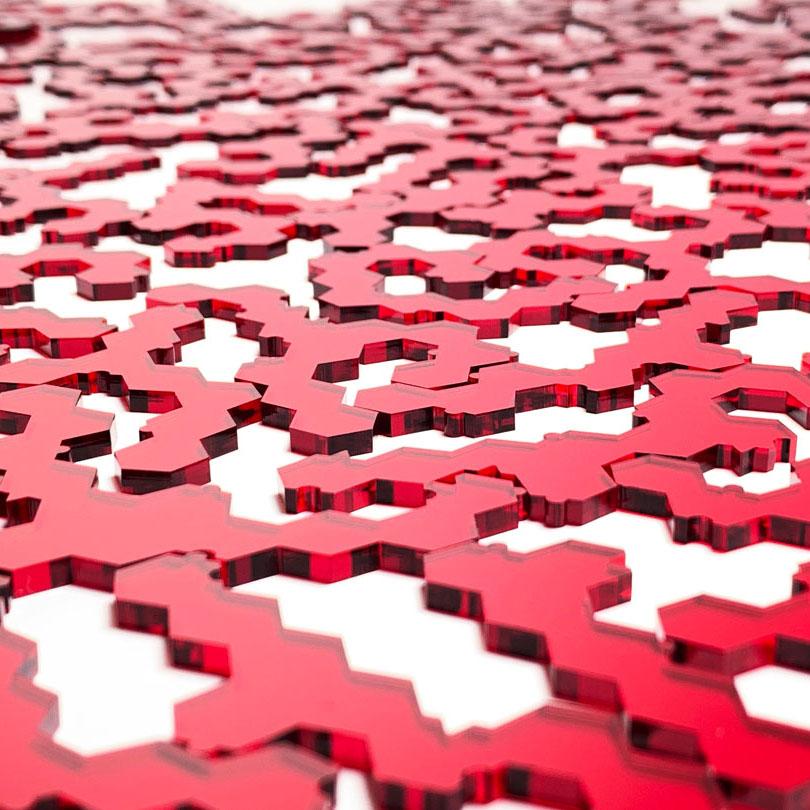 Keyway's Impossible Jigsaw Puzzle pieces zoomed No.102A in Clear Red Acrylic