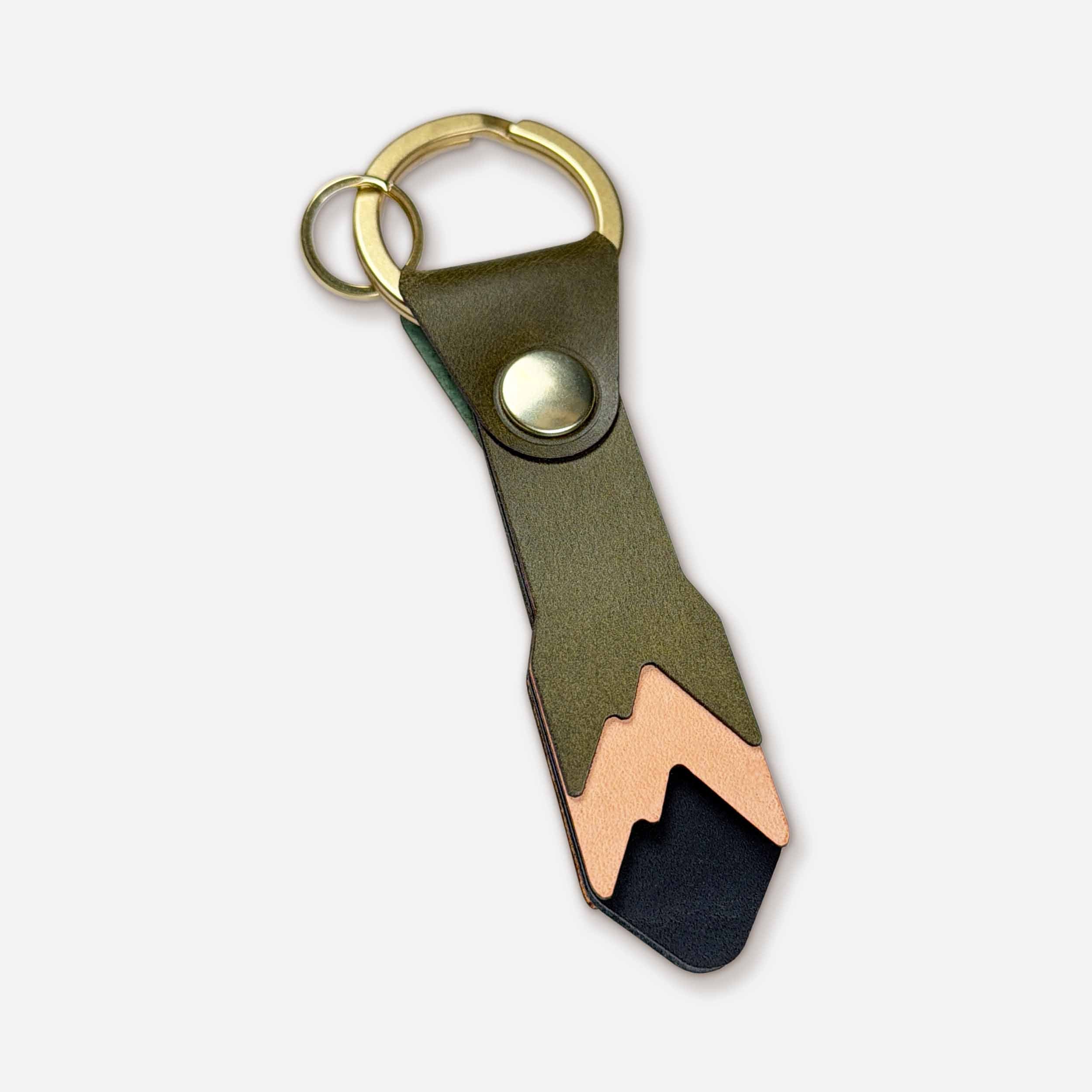 Keyway Alpine handmade leather keychain — olive Italian full-grain veg-tan with brass hardware and mountain design