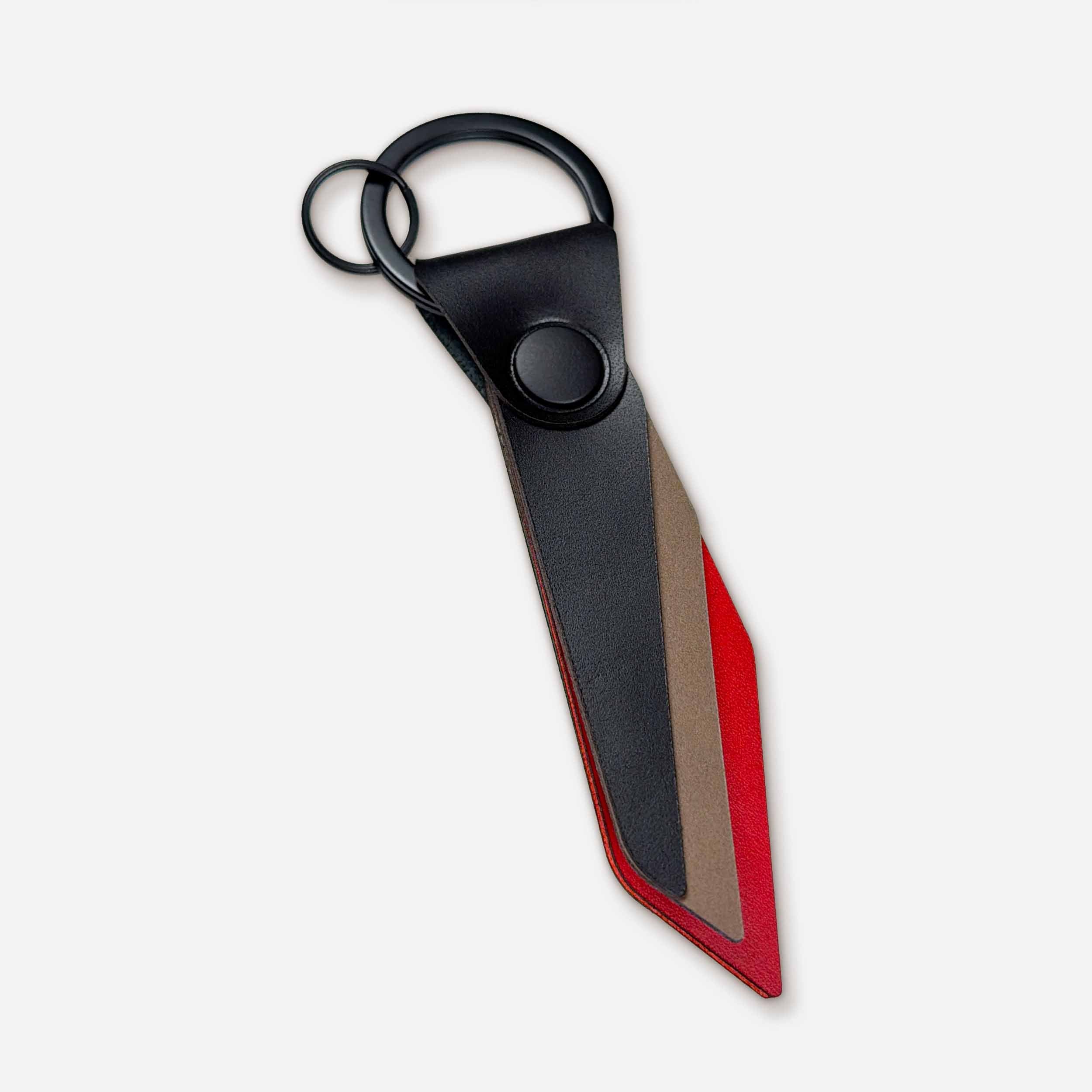 Keyway Flint handmade leather keychain — black Italian full-grain veg-tan with PVD hardware and striker design