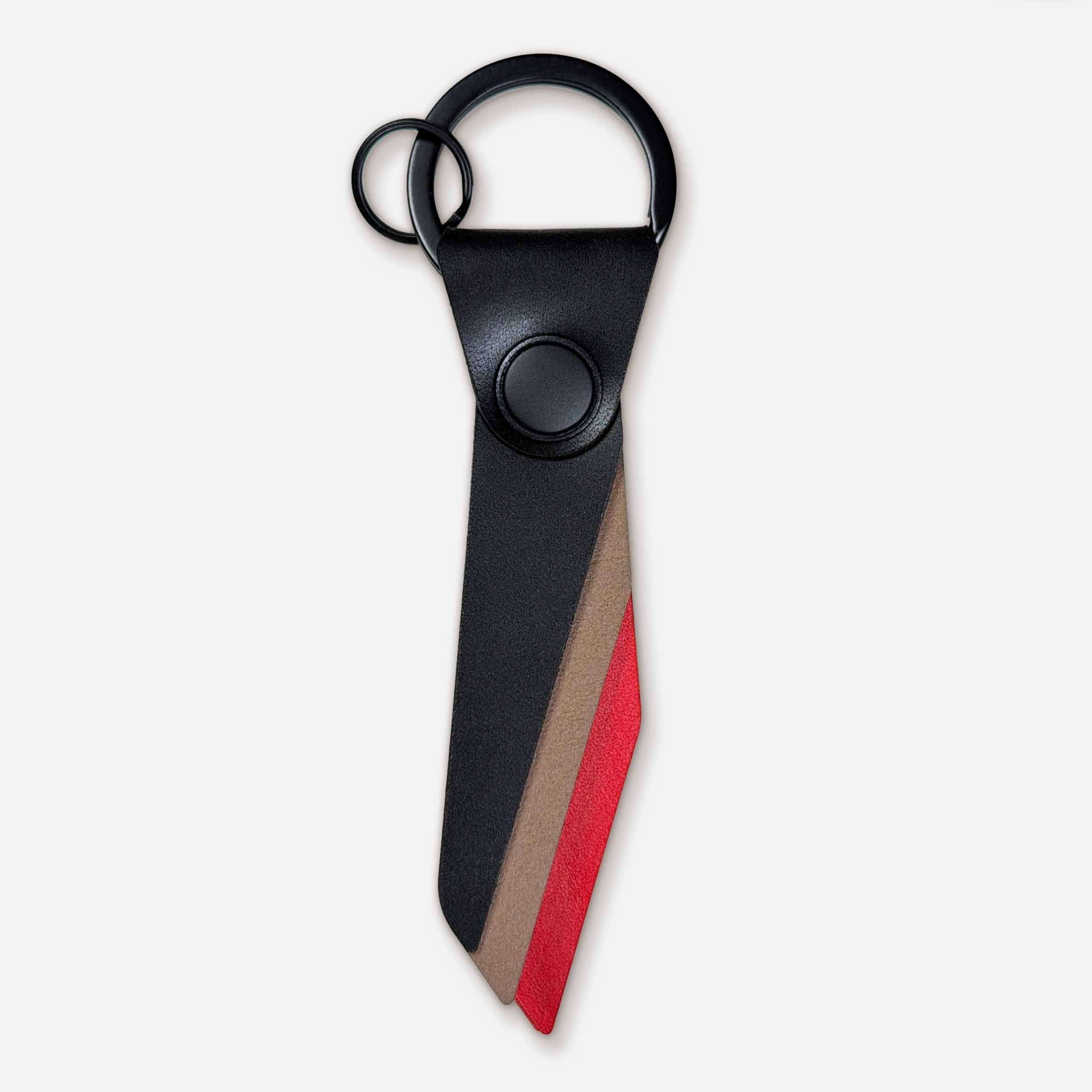 Front view of Keyway Flint leather keychain with black PVD hardware and angular striker design