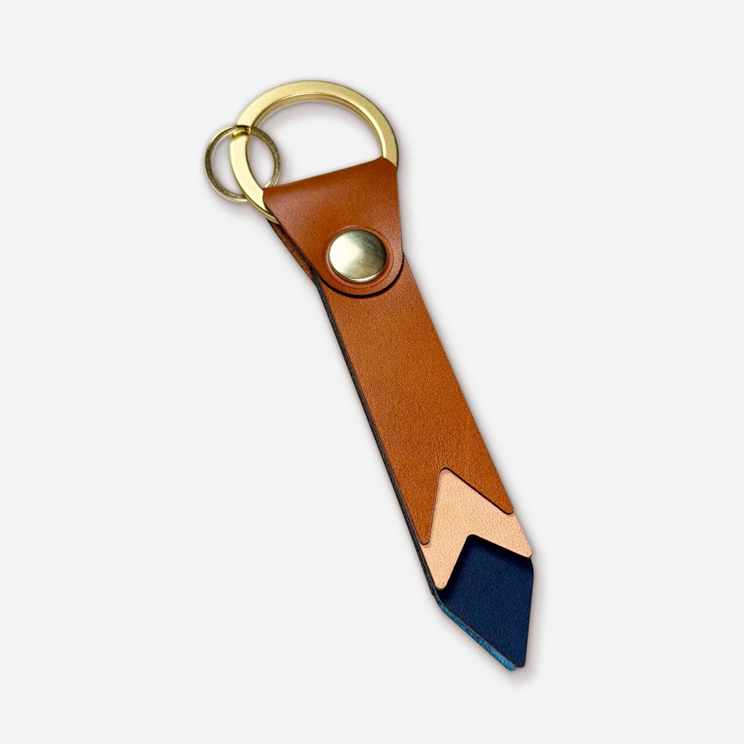 Keyway Horizon handmade leather keychain — whiskey Italian full-grain veg-tan with brass hardware and sunset chevron design