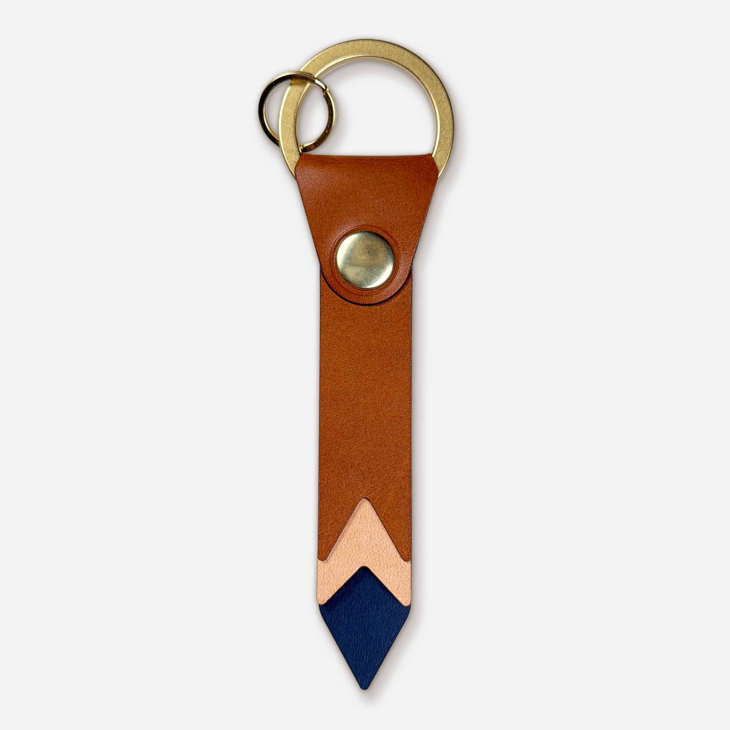 Front view of Keyway Horizon leather keychain with brass hardware and stacked sunset chevron design