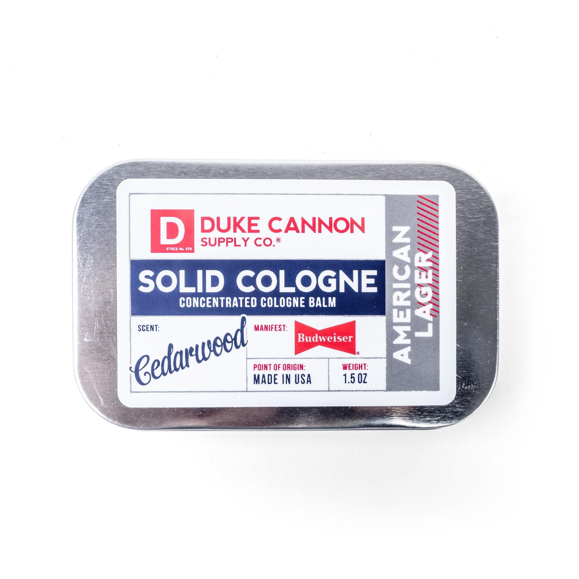 Zoomed view of Duke Cannon American Lager Cedarwood Men's Solid Cologne in Metal Tin 1.5oz | Keyway