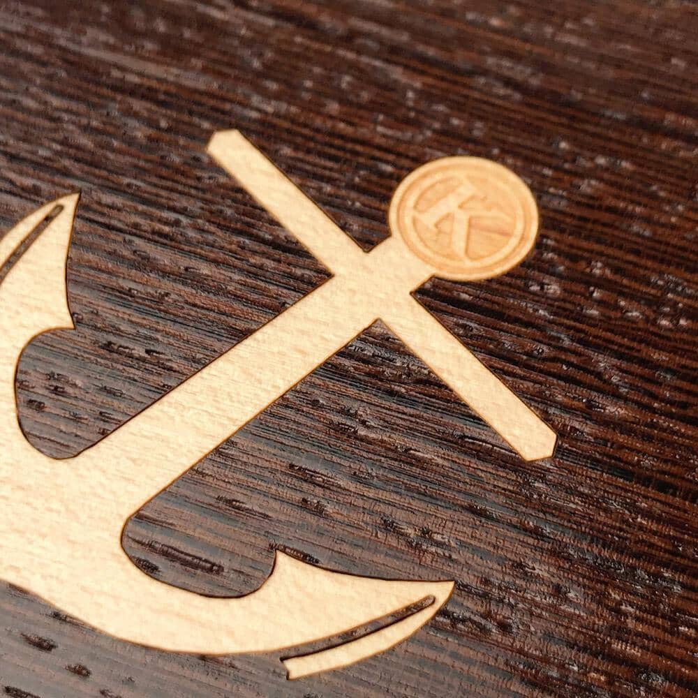 Zoomed in detailed shot of the Anchor Wenge Wood iPhone 15 Plus MagSafe Case by Keyway Designs