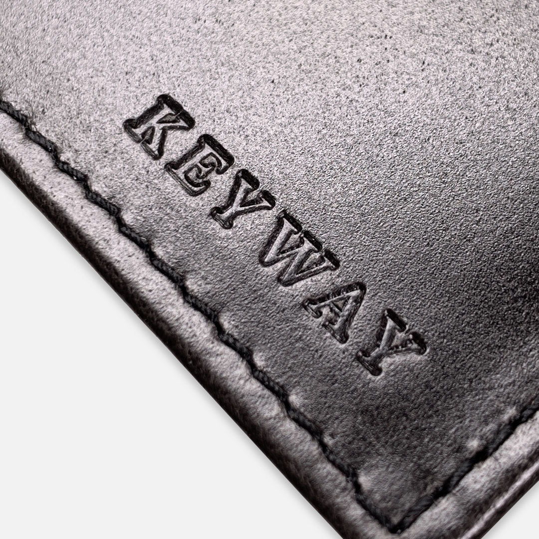 Keyway Full-grain Leather Passport Wallet, Charcoal, detailed view of embossing