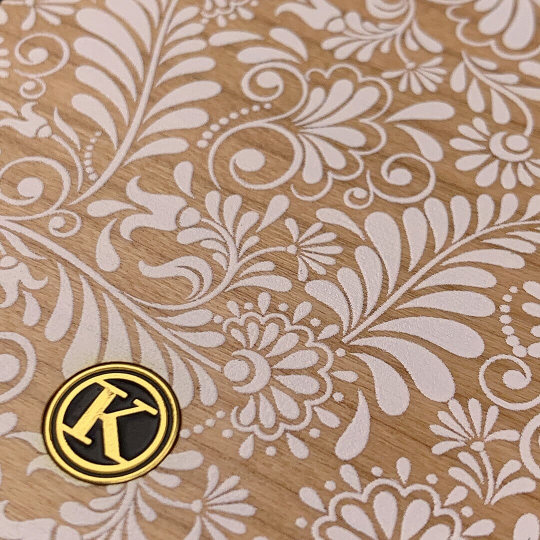 Zoomed in detailed shot of the white ink flowing botanical print on Cherry wood iPhone 7/8 Case by Keyway Designs