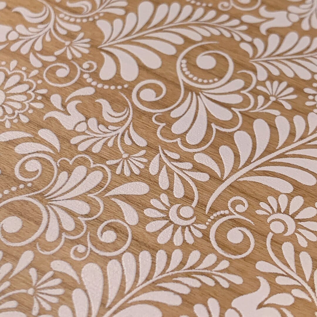 Zoomed in detailed shot of the white ink flowing botanical print on Cherry wood iPhone XR Case by Keyway Designs