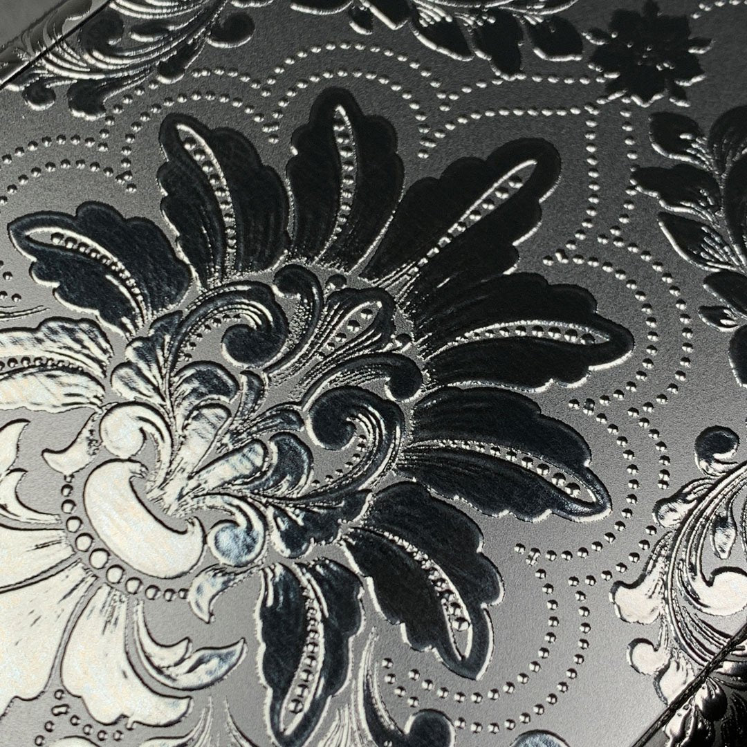 Zoomed in detailed shot of the detailed gloss Damask pattern printed on matte black impact acrylic Galaxy S10e Case by Keyway Designs