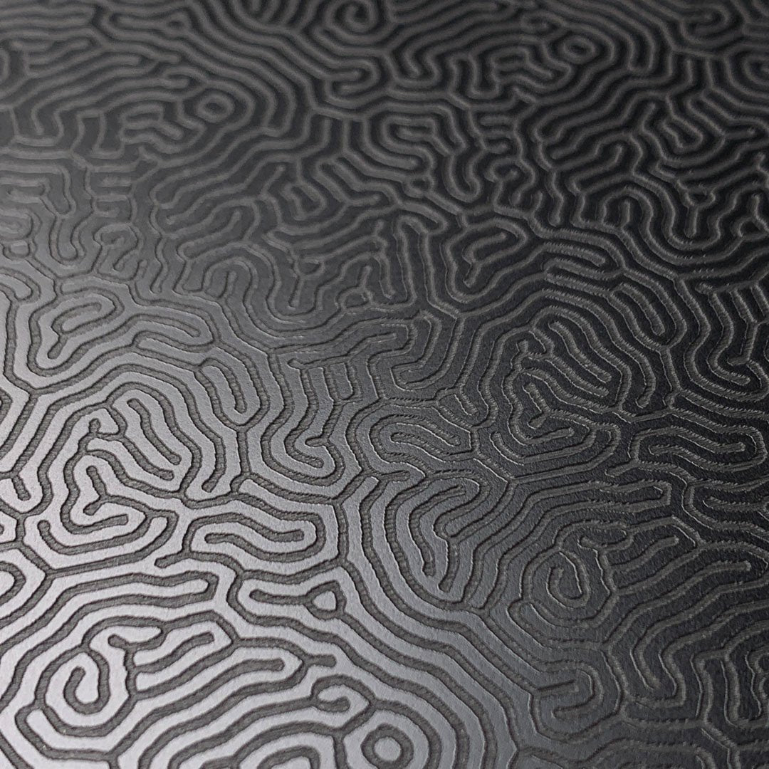 Zoomed in detailed shot of the highly detailed organic growth engraving on matte black impact acrylic Galaxy S10 Case by Keyway Designs