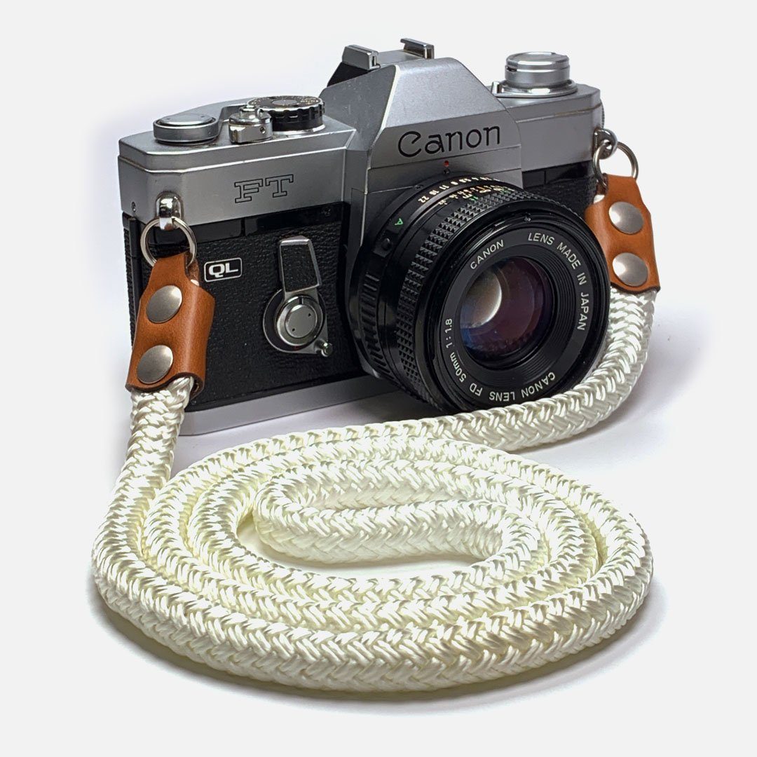 Camera Neck Strap. Leather, Brass and Nylon. Designed to hang below the chest.