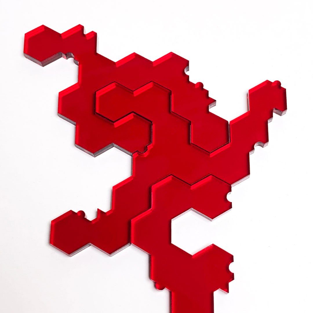 Keyway's Impossible Jigsaw Puzzle piece assembly examlpe No.102A in Clear Red Acrylic