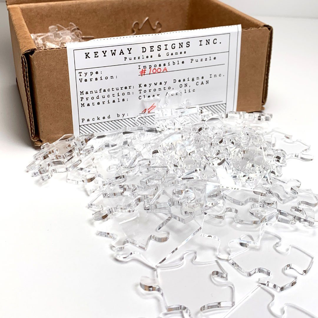 Keyway's Impossible Jigsaw Puzzle in Clear Acrylic spilled