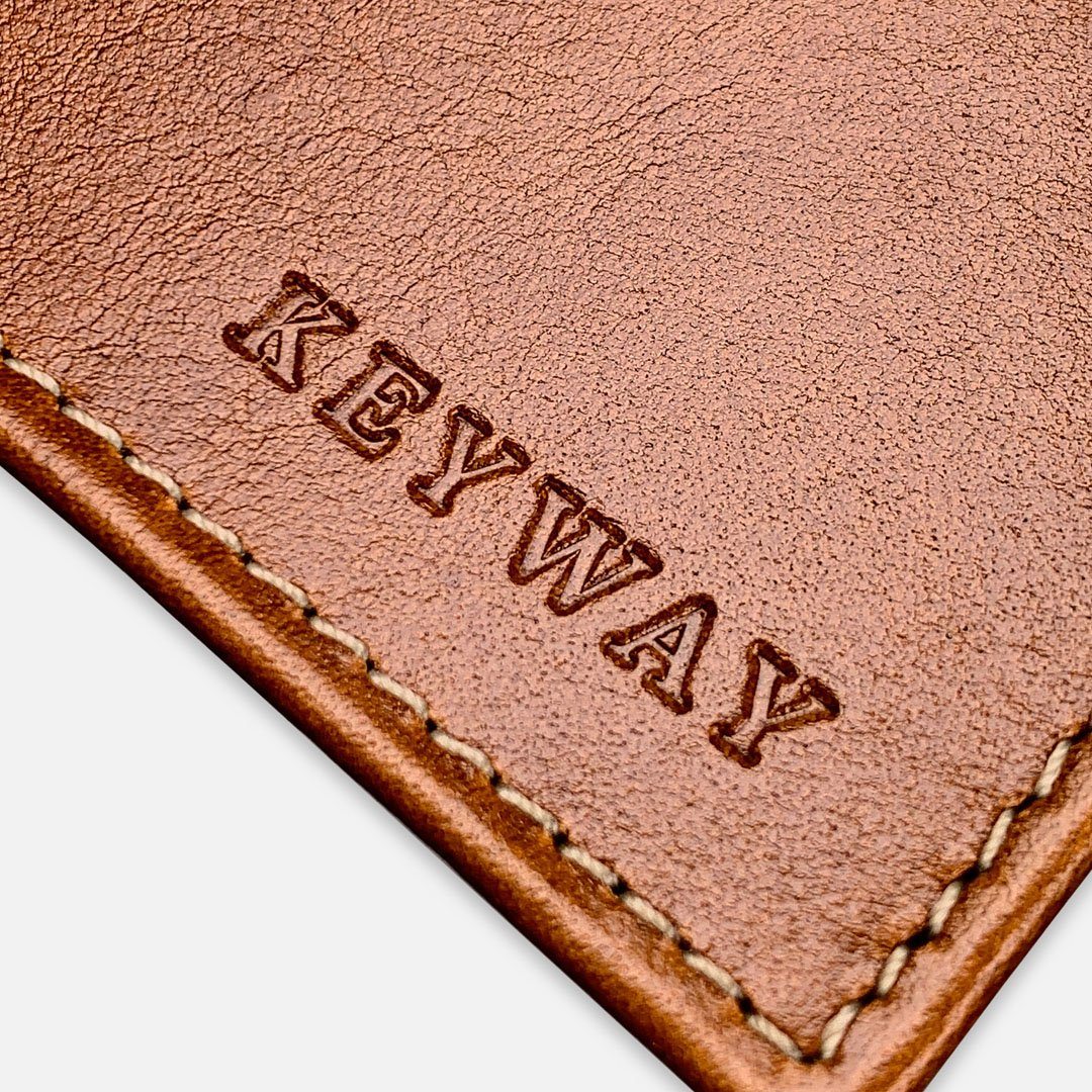 Keyway Full-grain Leather Passport Wallet, Whiskey, detailed view of embossing