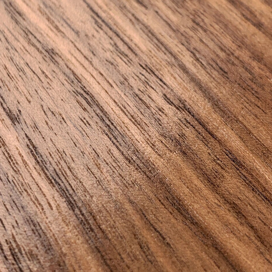 Zoomed in detailed shot of the Walnut Pure Minimalist Wood iPhone 13 Mini Case by Keyway Designs
