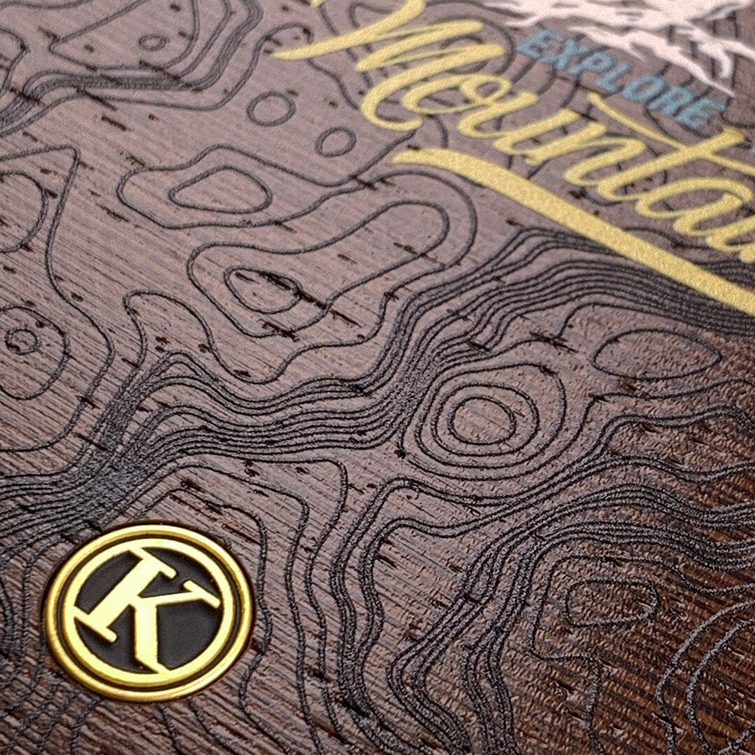 Zoomed in detailed shot of the crisp topographical map with Explorer badge printed on wenge wood Galaxy S21 Case by Keyway Designs
