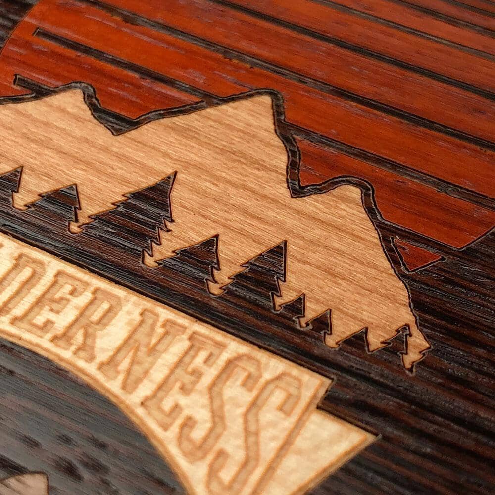 Zoomed in detailed shot of the Wilderness Wenge Wood iPhone 15 Plus MagSafe Case by Keyway Designs
