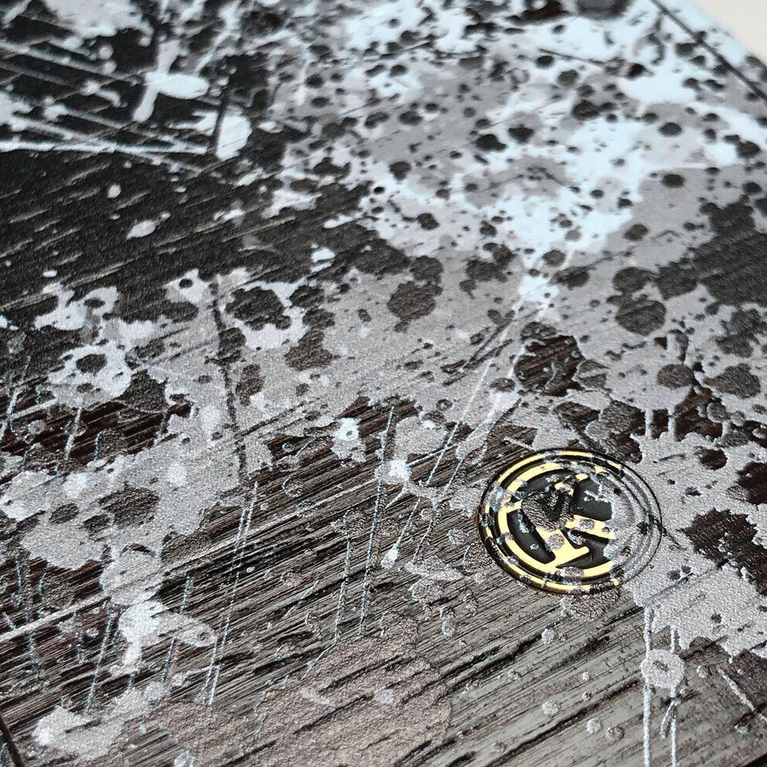 Zoomed in detailed shot of the aggressive, monochromatic splatter pattern overprintedprinted Wenge Wood Galaxy S9 Case by Keyway Designs