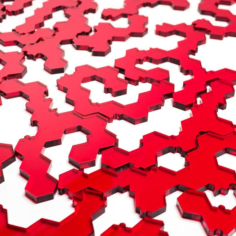 Keyway's Impossible Jigsaw Puzzle pieces zoomed No.102A in Clear Red Acrylic