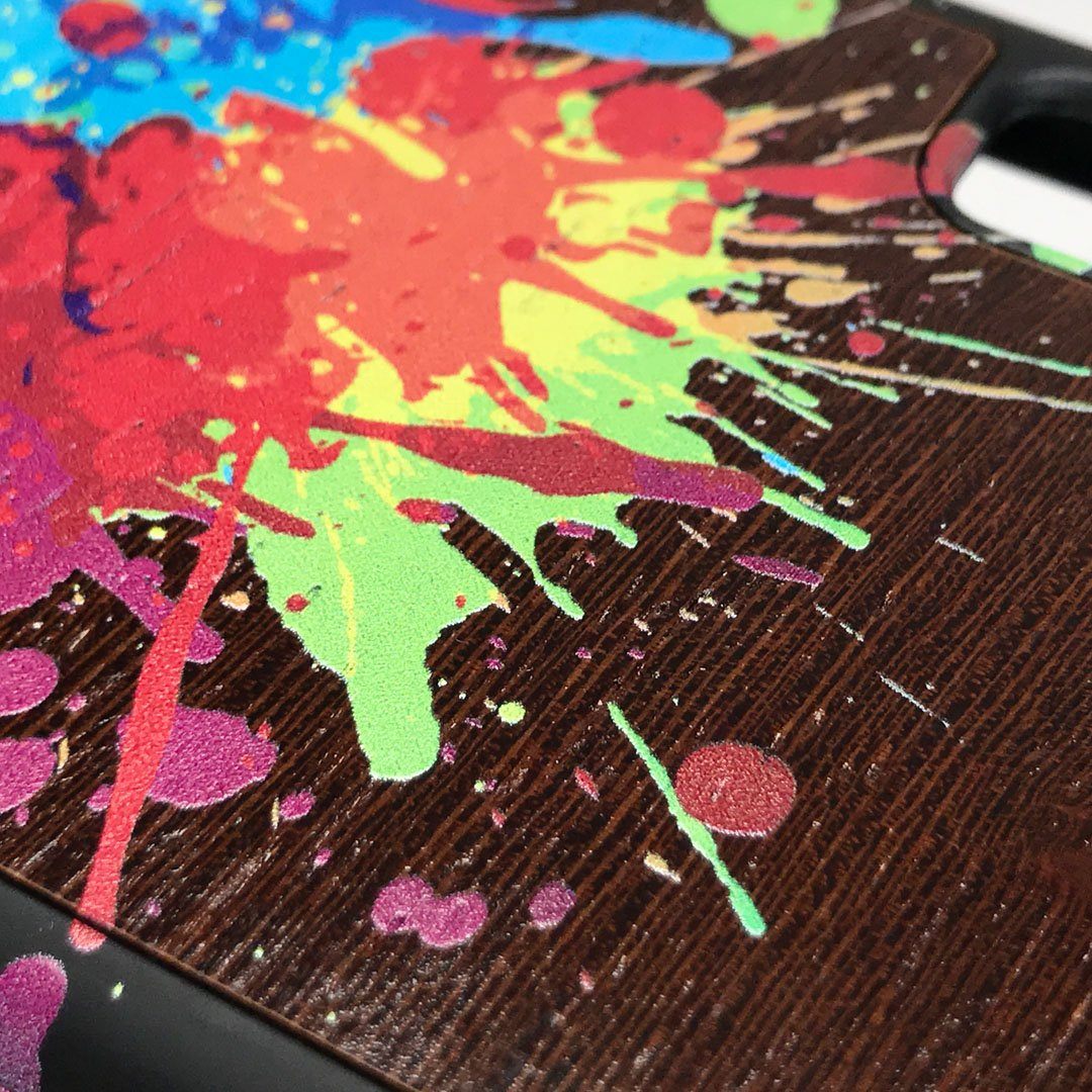 Zoomed in detailed shot of the illustration-style paint drops printed Wenge Wood iPhone X Case by Keyway Designs
