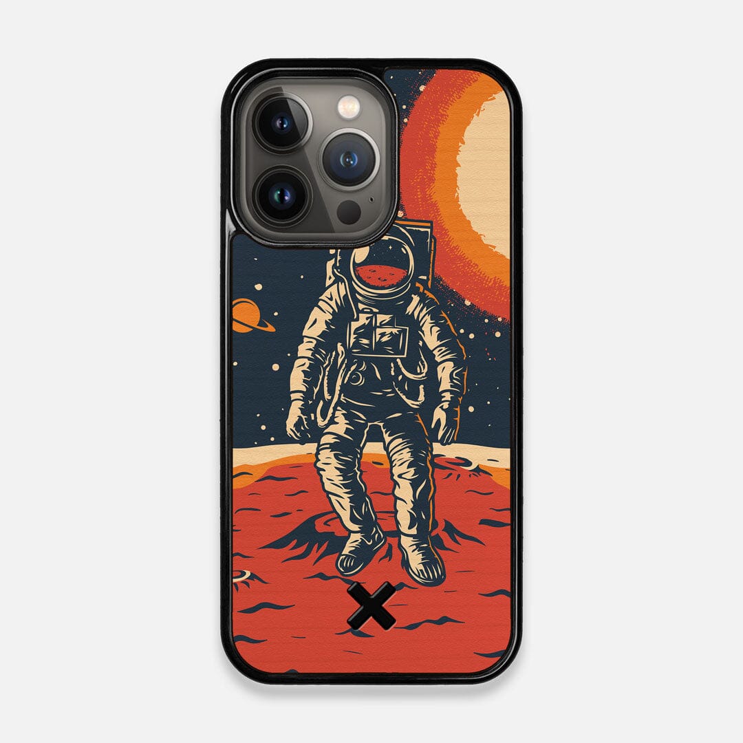 Front view of the stylized astronaut space-walk print on Cherry wood iPhone 13 Pro Case by Keyway Designs