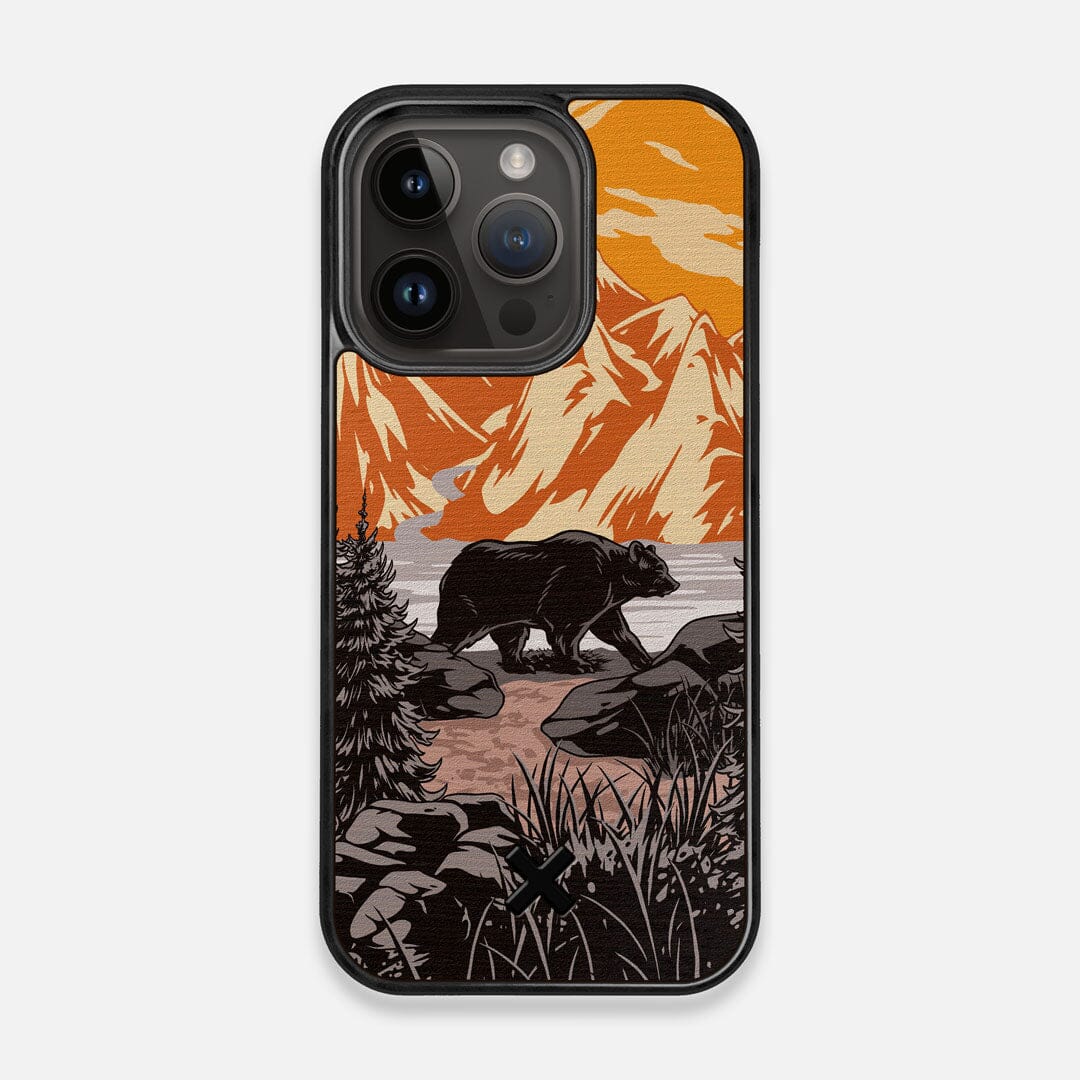 Front view of the stylized Kodiak bear in the mountains print on Wenge wood iPhone 14 Pro MagSafe Case by Keyway Designs
