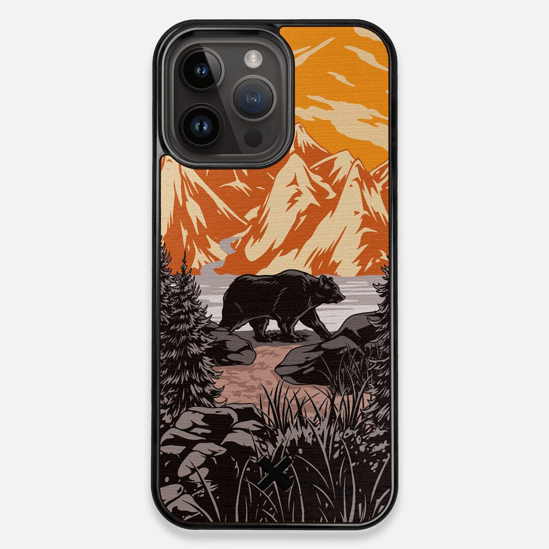 Front view of the stylized Kodiak bear in the mountains print on Wenge wood iPhone 14 Pro Max MagSafe Case by Keyway Designs